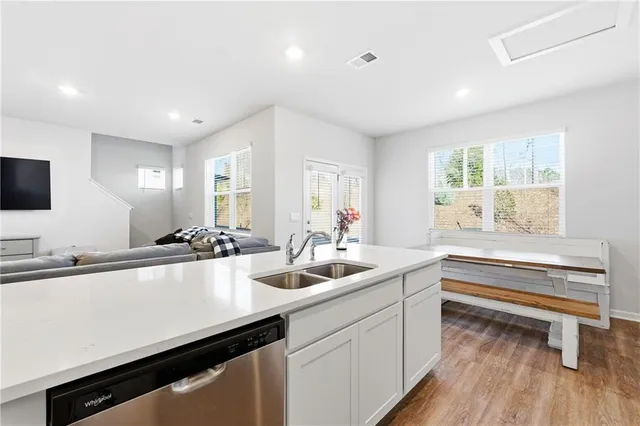 a kitchen with a sink and a refrigerator
