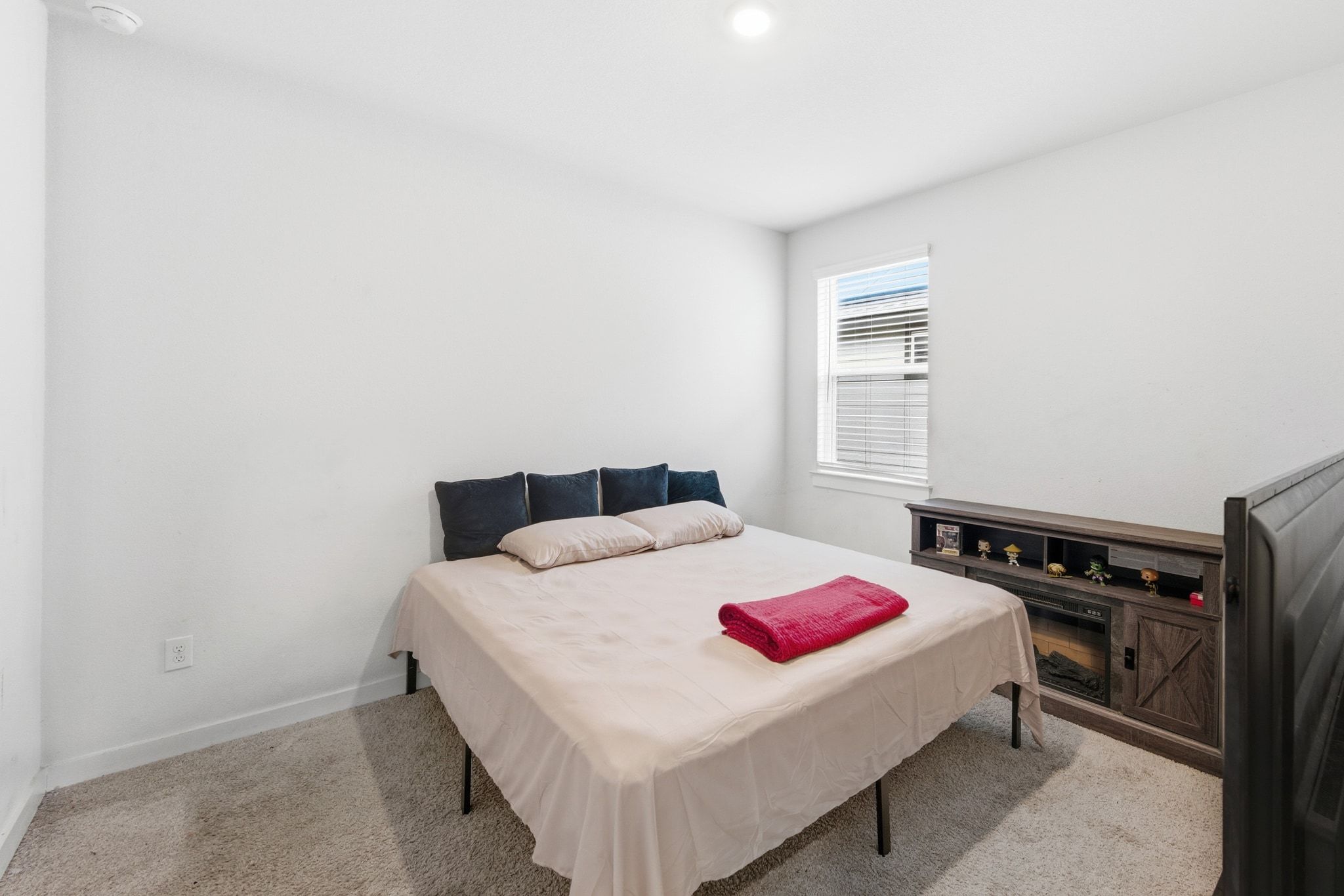 241 Banff Drive Kyle, TX 78640 - Photo 19 of 28 a bedroom with a bed and a dresser