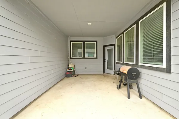 a view of house with outdoor seating