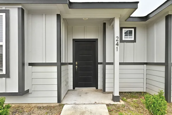 a view of front door and bedroom