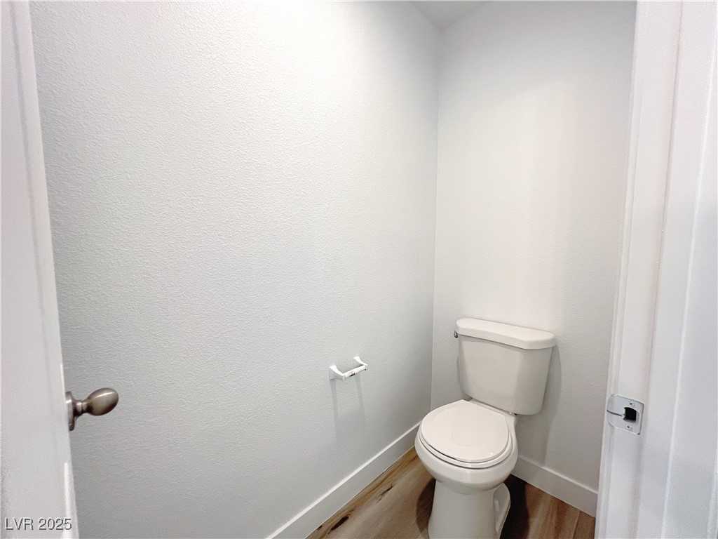 8821 Steaming Thunder Court Las Vegas, NV 89148 - Photo 29 of 31 Bathroom with wood finished floors and baseboards