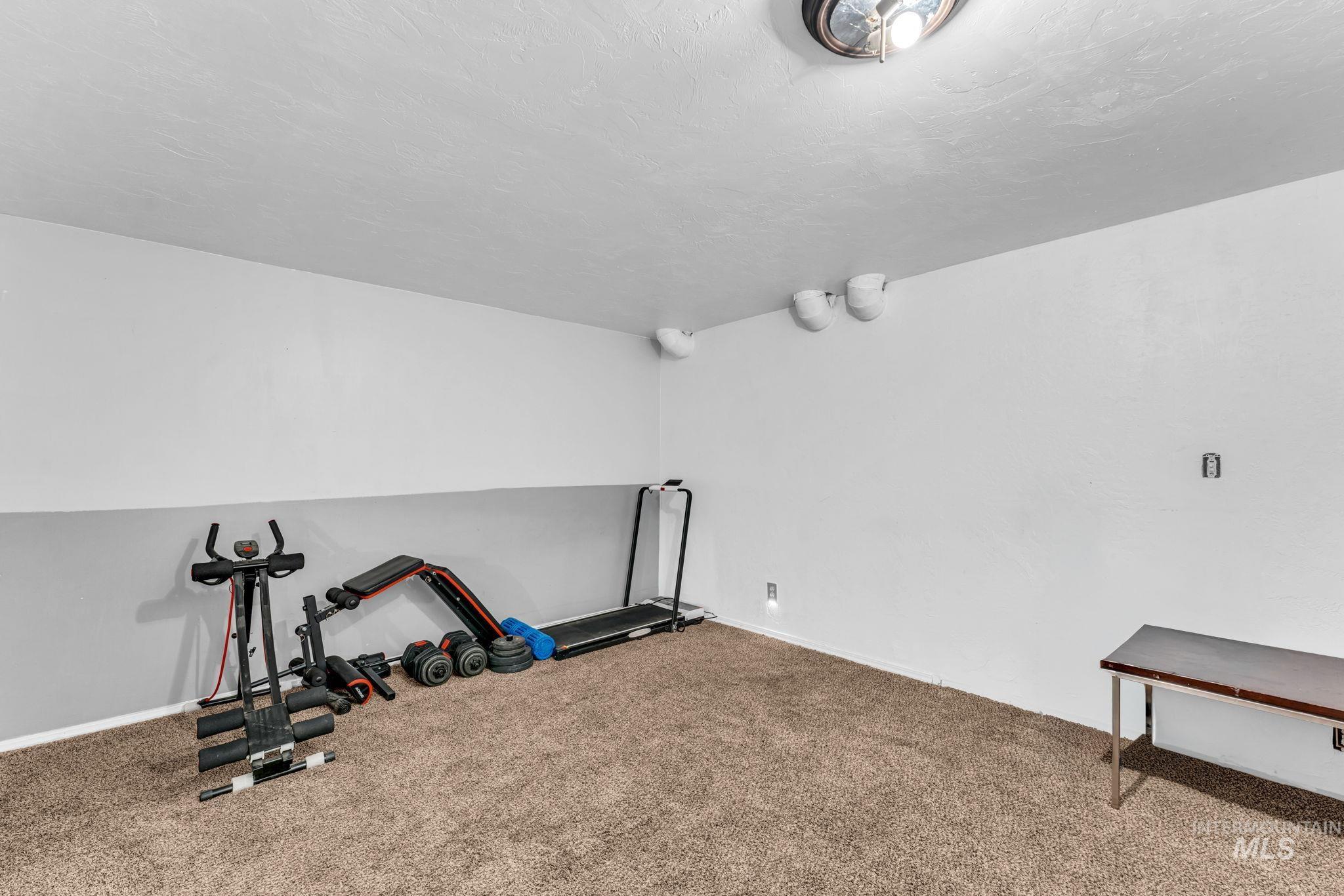 820 Meadows Drive Twin Falls, ID 83301 - Photo 28 of 38 Carpeted interior space with light gray walls and a textured ceiling