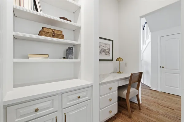a view of room with window and hardwood floor