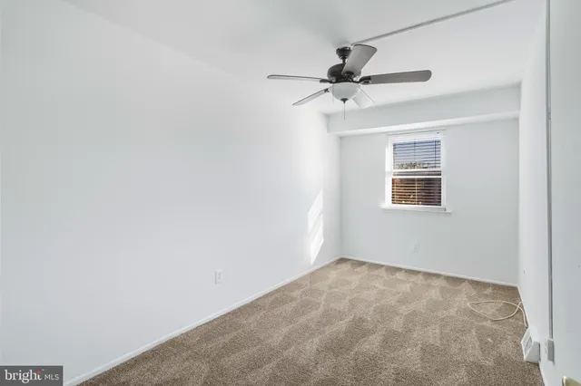 a view of a hallway with a fan