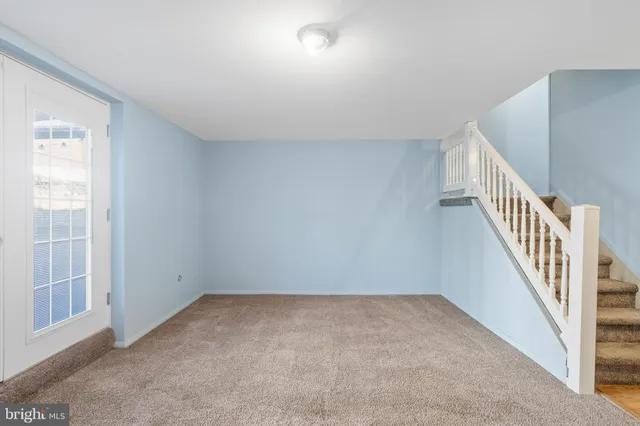 a bathroom with a granite countertop sink toilet and mirror