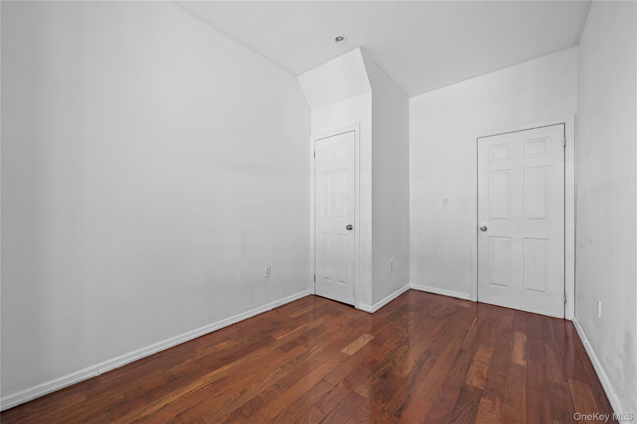 1323 Sutter Avenue Brooklyn, NY 11208 - Photo 15 of 46 a view of an empty room with wooden floor