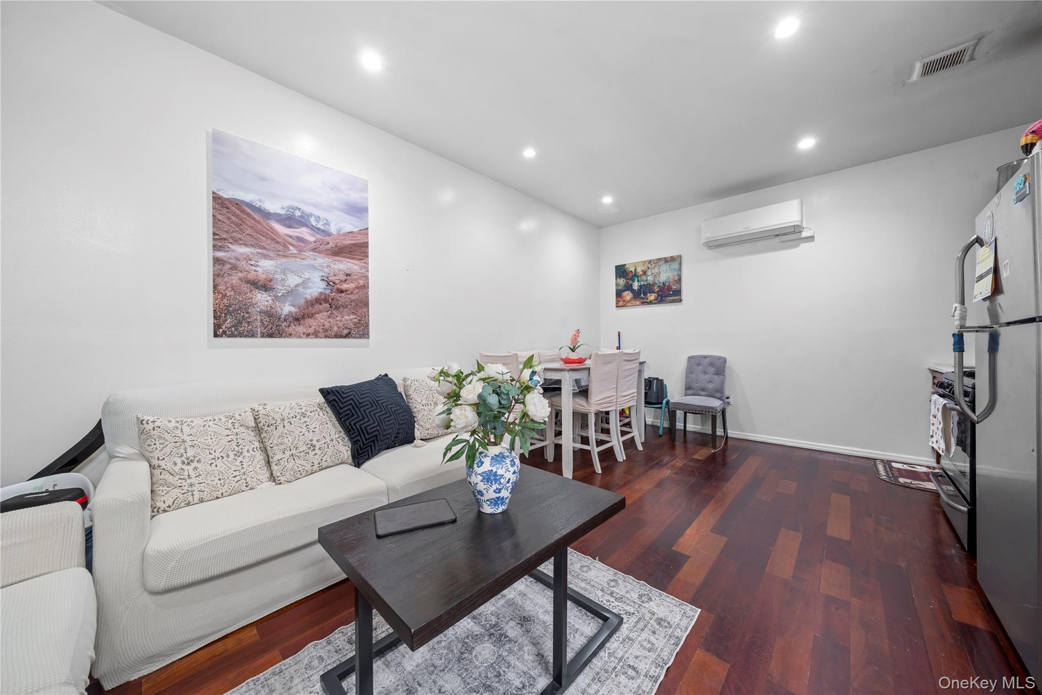 1323 Sutter Avenue Brooklyn, NY 11208 - Photo 20 of 46 a living room with furniture and wooden floor