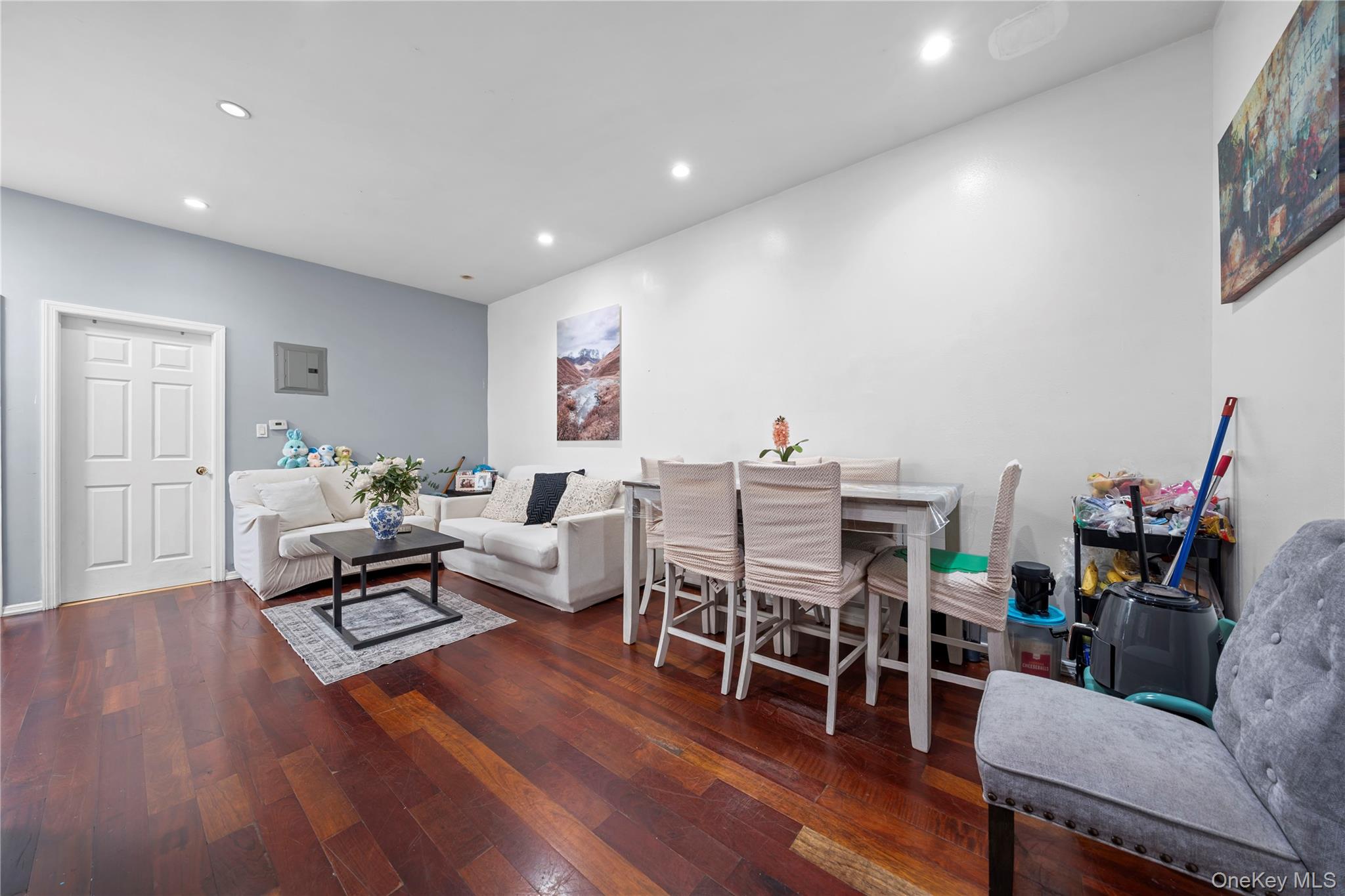 1323 Sutter Avenue Brooklyn, NY 11208 - Photo 22 of 46 a living room with furniture and a wooden floor