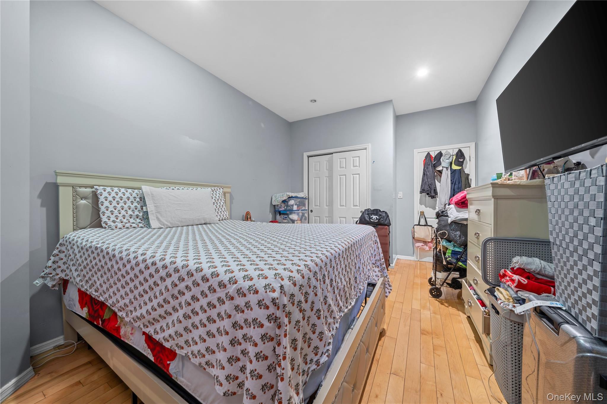 1323 Sutter Avenue Brooklyn, NY 11208 - Photo 24 of 46 a bedroom with bed and a flat tv screen