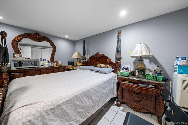 a bed room with a bed and a mirror