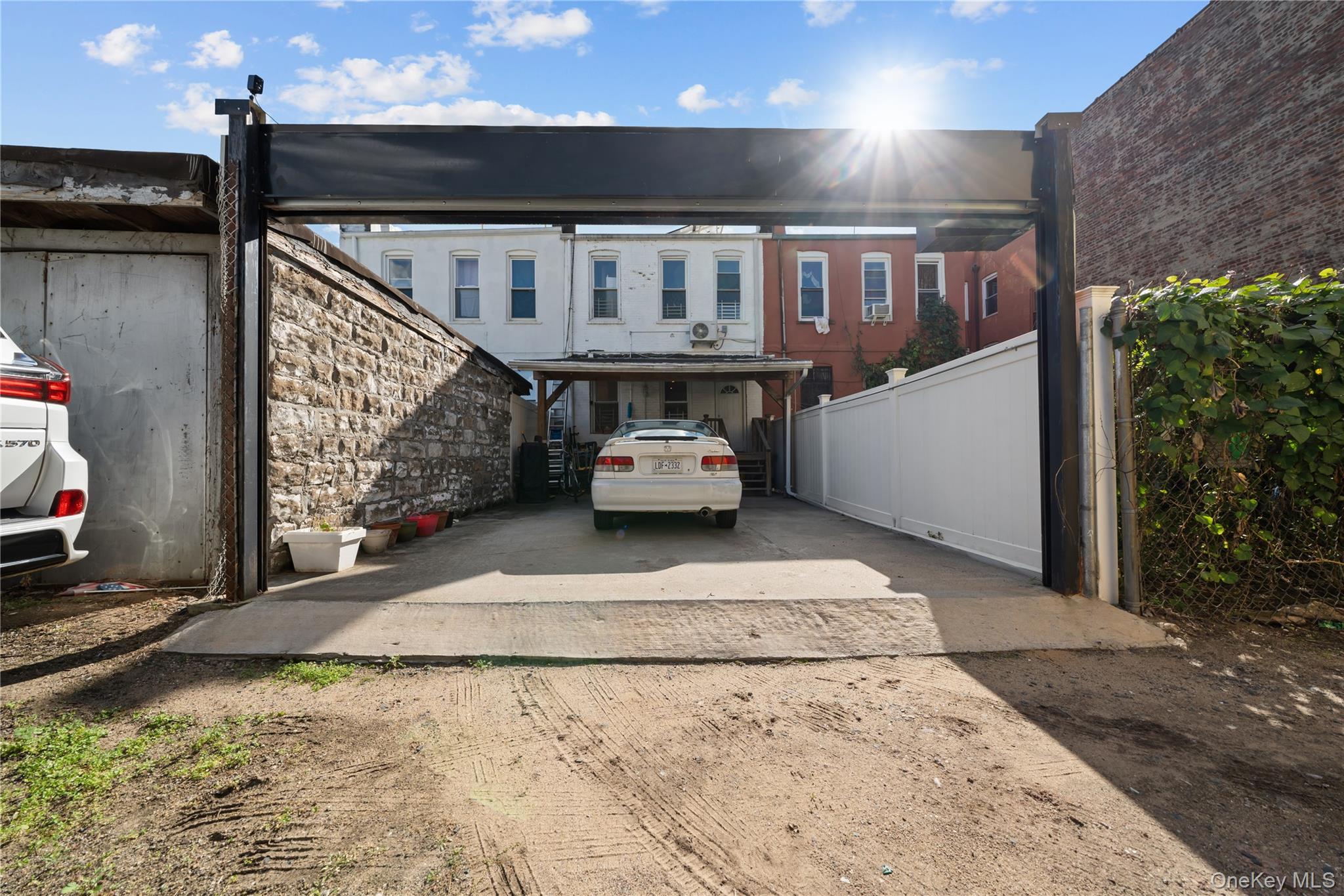 1323 Sutter Avenue Brooklyn, NY 11208 - Photo 36 of 46 a car parked in front of house