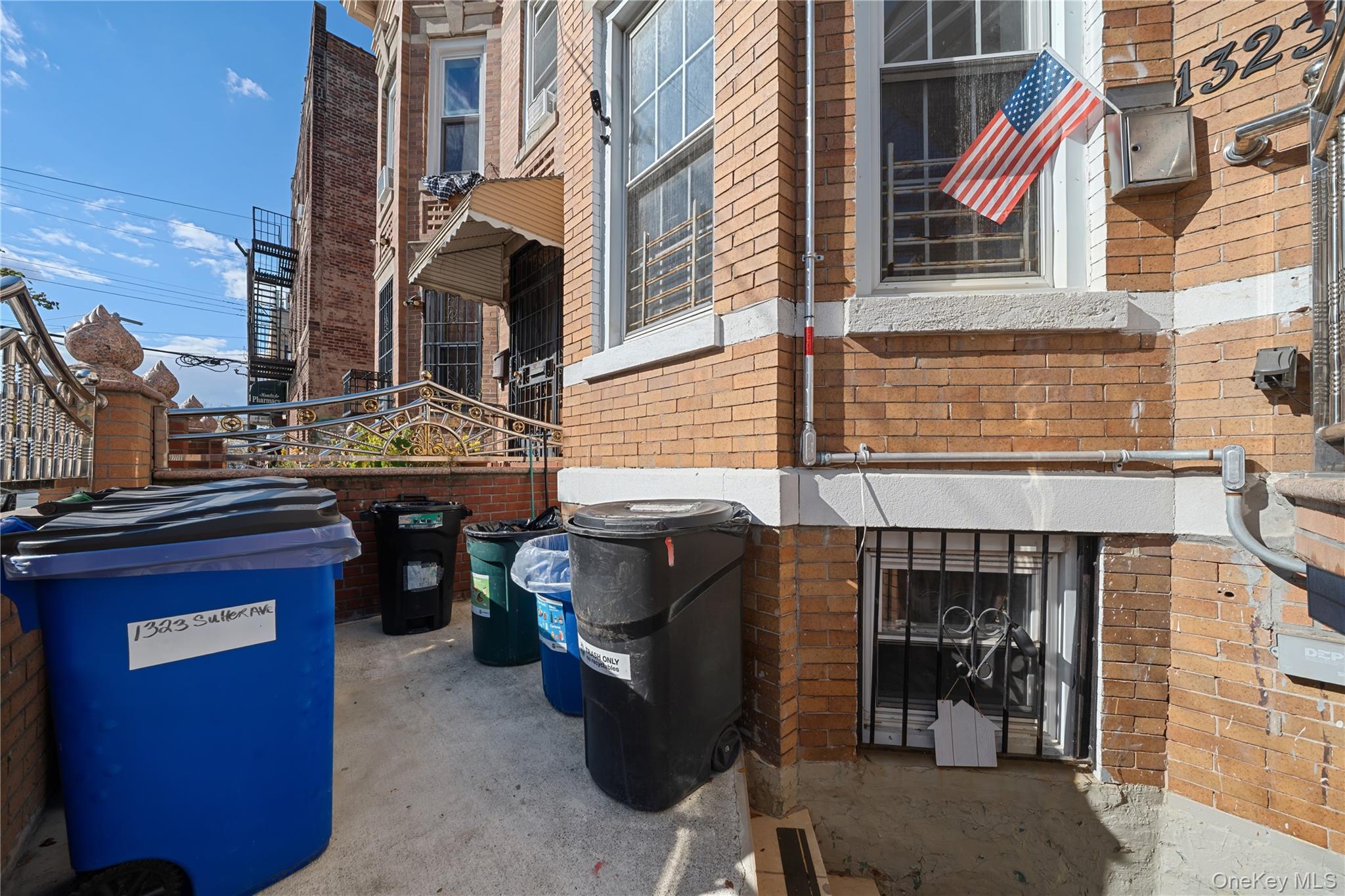1323 Sutter Avenue Brooklyn, NY 11208 - Photo 39 of 46 a front view of a building with sitting area
