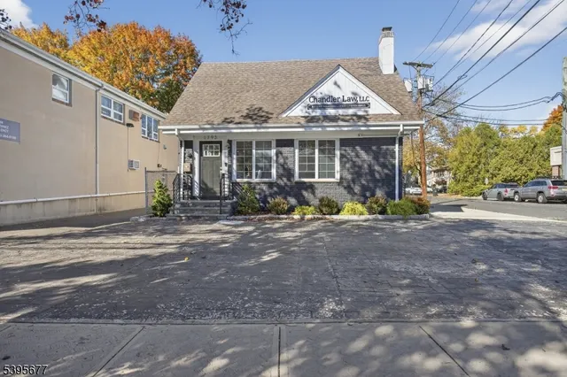 a view of a house with garden and plants