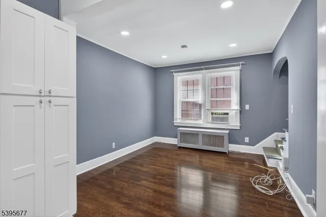 a bathroom with a bathtub and a window