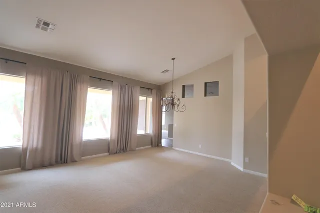 a view of empty room with windows