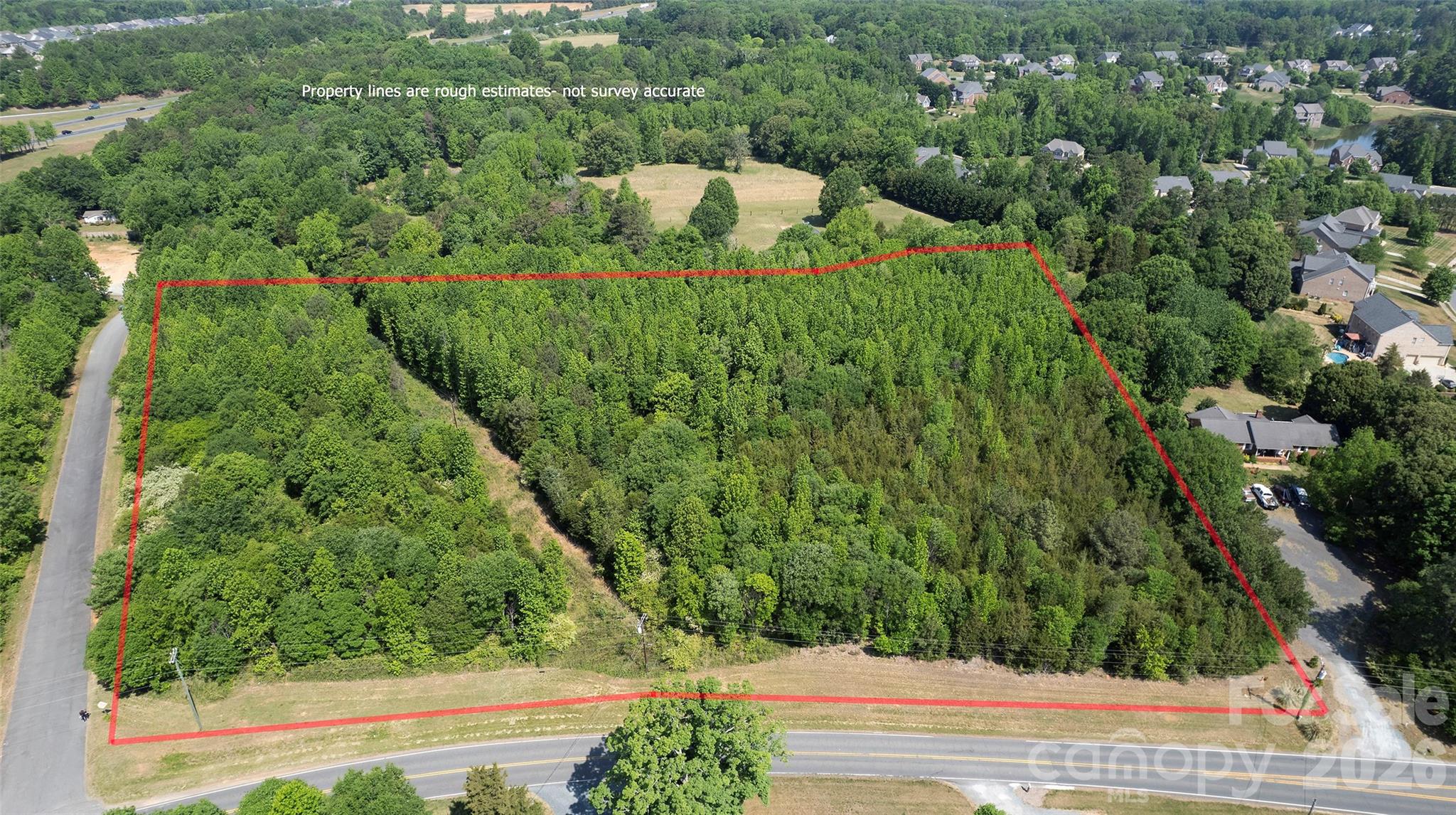 8115 Brief Road Mint Hill, NC 28227 - Photo 8 of 10 an aerial view of a house with a yard