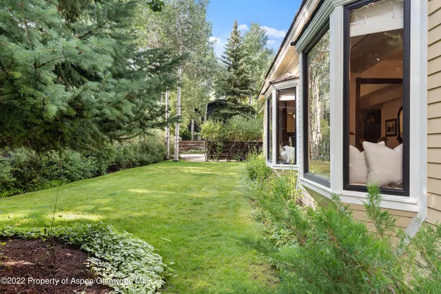 a view of a back yard of the house