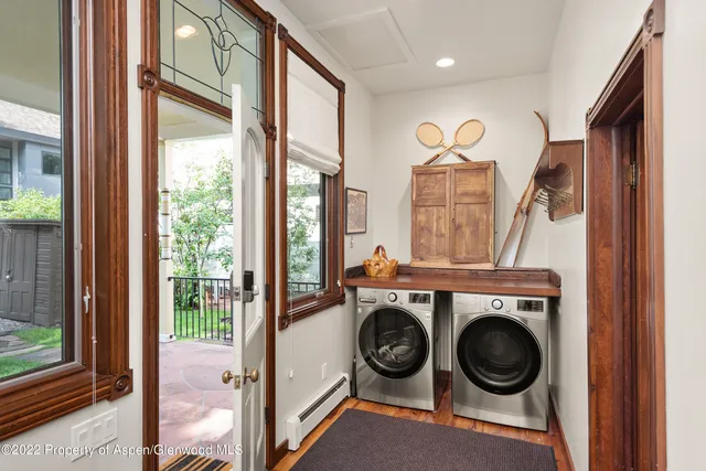 a view of a hallway with washer and dryer