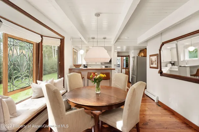 a view of a dining room with furniture window and outside view