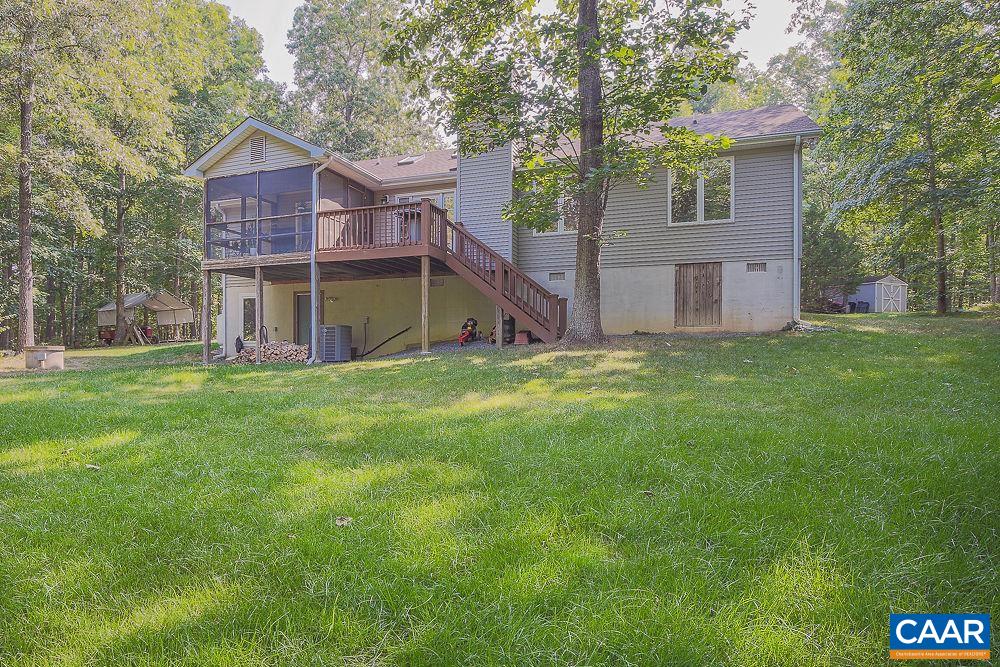 2300 Gobblers Ridge Charlottesville, VA 22902 - Photo 33 of 37 a view of a house with a big yard and large trees