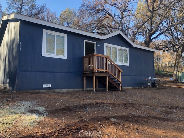 15894 Kugelman Street Lower Lake, CA 95457 - Photo 1 of 9 a house that has a tree in front of it