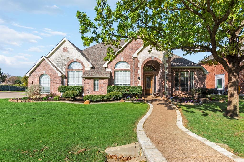 1200 Rio Bravo Way Shady Shores, TX 76208 - Photo 1 of 39 a front view of a house with a yard and garage