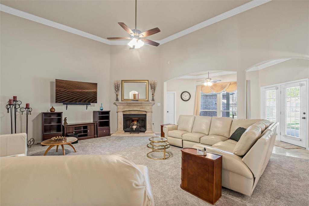 1200 Rio Bravo Way Shady Shores, TX 76208 - Photo 14 of 39 a living room with furniture a fireplace and a flat screen tv