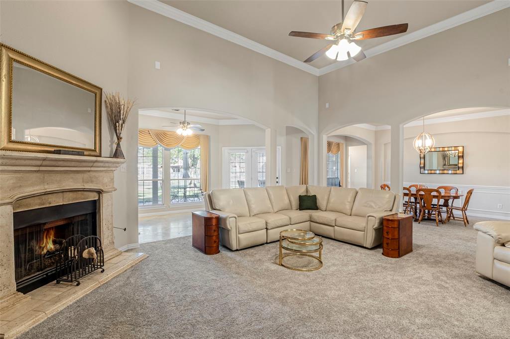 1200 Rio Bravo Way Shady Shores, TX 76208 - Photo 17 of 39 a living room with furniture a fireplace and a flat screen tv