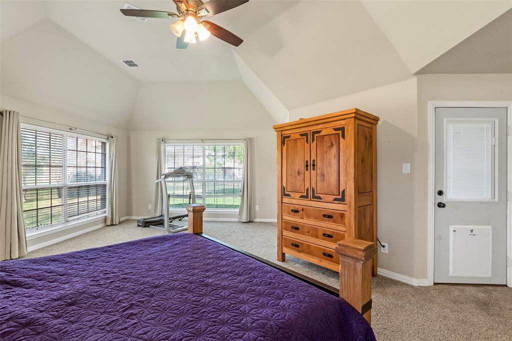 1200 Rio Bravo Way Shady Shores, TX 76208 - Photo 20 of 39 a bedroom with a bed and large windows