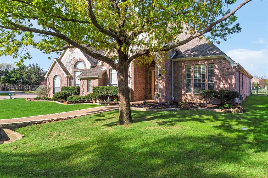 1200 Rio Bravo Way Shady Shores, TX 76208 - Photo 2 of 39 a front view of house with yard and green space