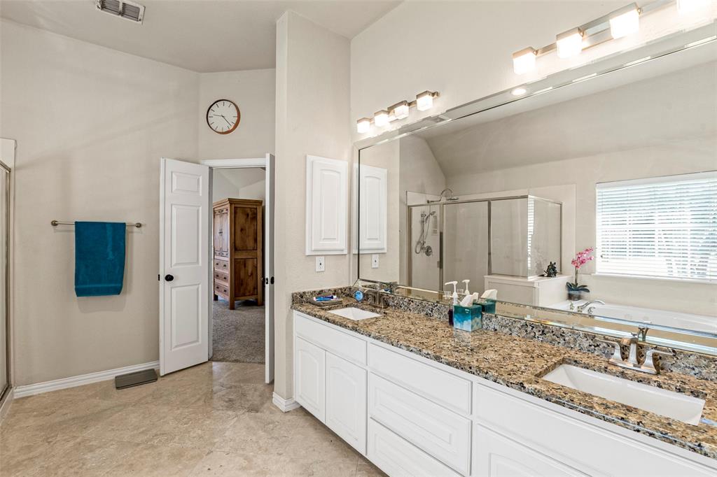 1200 Rio Bravo Way Shady Shores, TX 76208 - Photo 23 of 39 a bathroom with sinks granite countertop tub shower and a mirror