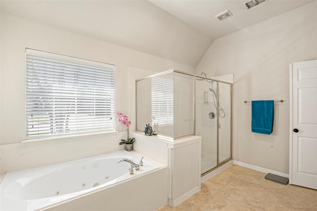 1200 Rio Bravo Way Shady Shores, TX 76208 - Photo 24 of 39 a bathroom with a bathtub and a shower