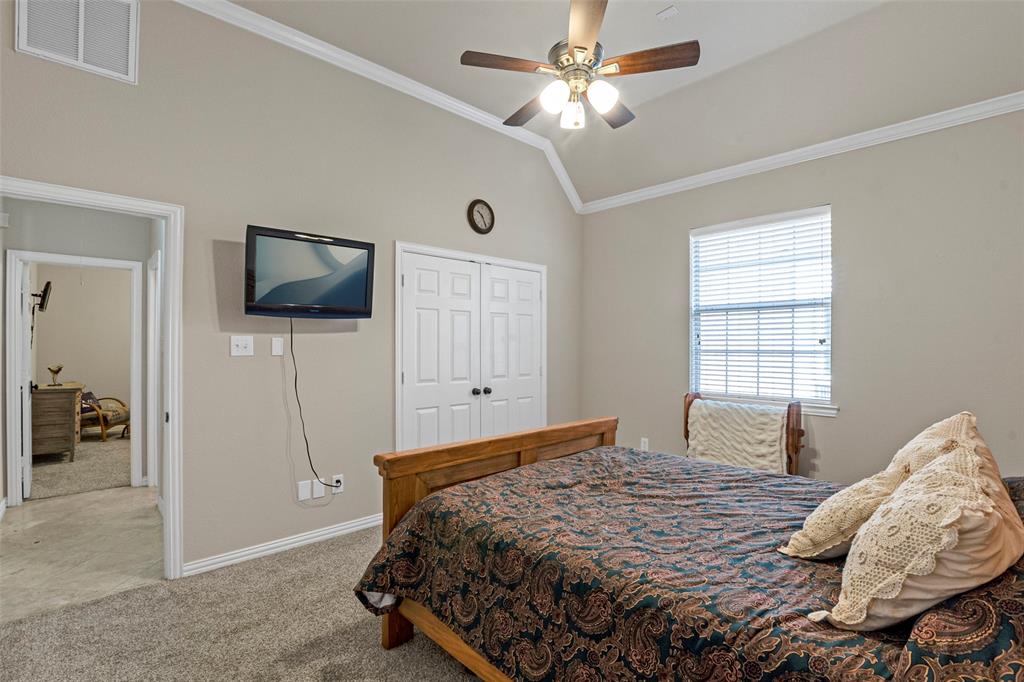 1200 Rio Bravo Way Shady Shores, TX 76208 - Photo 29 of 39 a bedroom with a bed and a flat screen tv