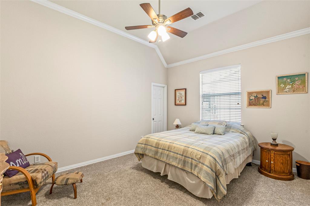 1200 Rio Bravo Way Shady Shores, TX 76208 - Photo 31 of 39 a bedroom with a bed and a chandelier