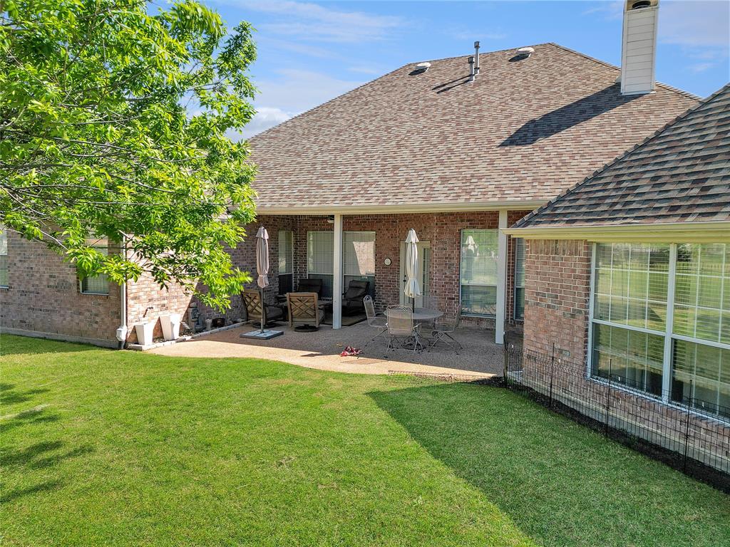 1200 Rio Bravo Way Shady Shores, TX 76208 - Photo 35 of 39 a view of a house with a yard and sitting area