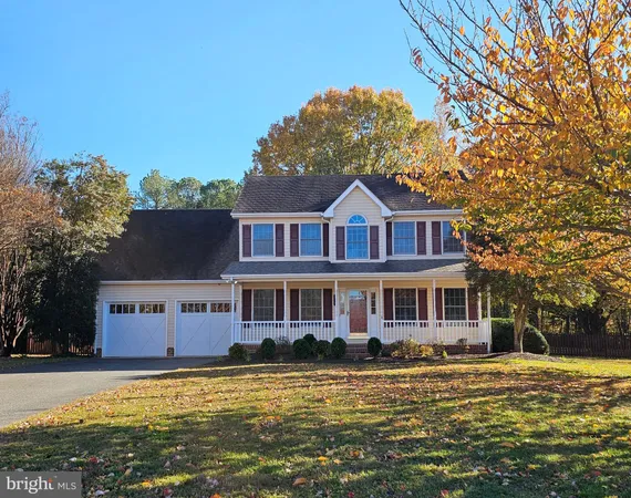 a front view of a house with a big yard