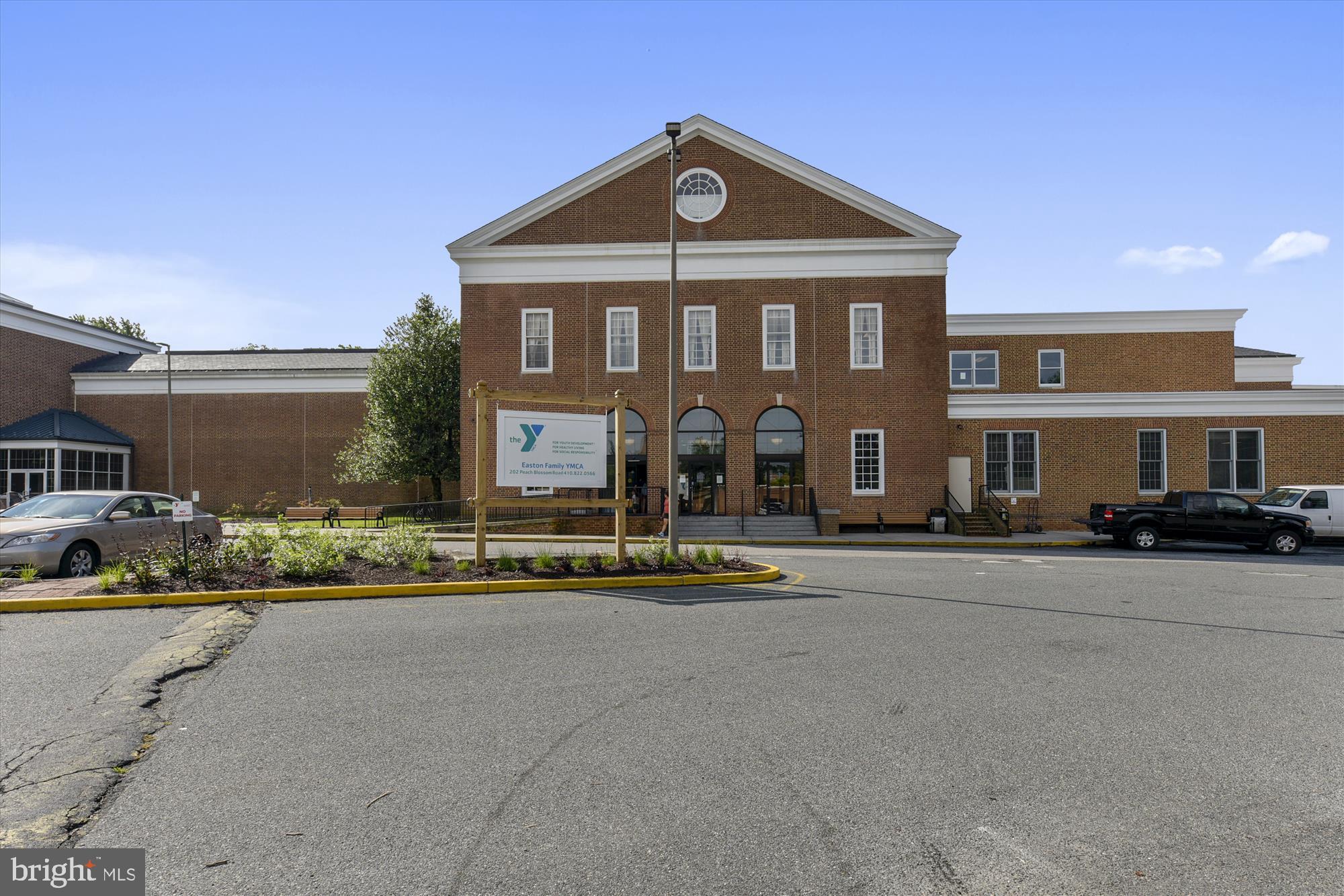 316 Spring Drive Easton, MD 21601 - Photo 4 of 7 a front view of a house with a yard