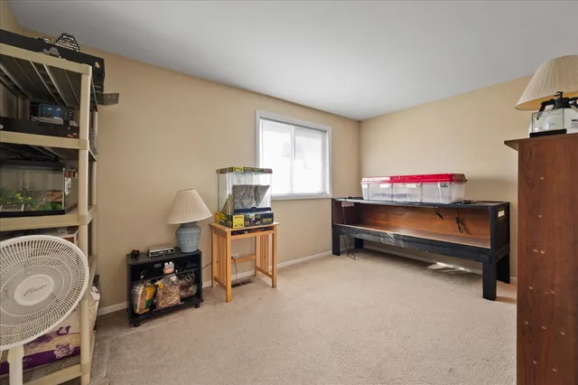 a view of room with hardwood wall and closet