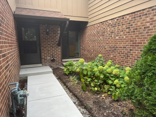 a view of a hallway with seating area