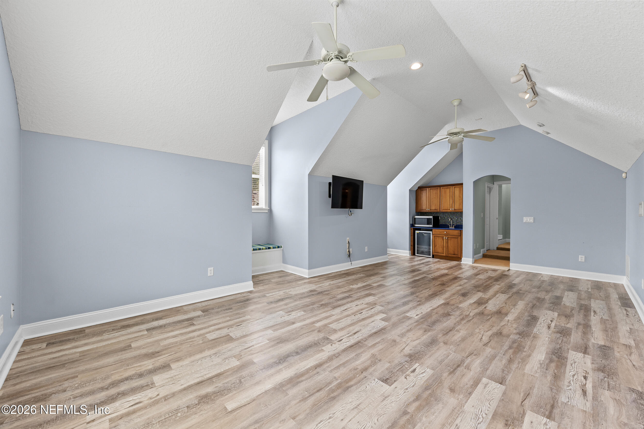 3225 Bishop Estates Road St. Johns, FL 32259 - Photo 59 of 90 a view of empty room with wooden floor and ceiling fan
