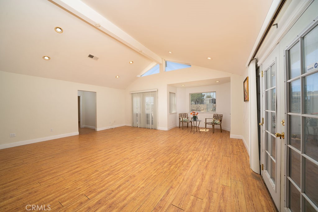 8851 Sonora Road Phelan, CA 92371 - Photo 8 of 26 a big room with wooden floor and furniture