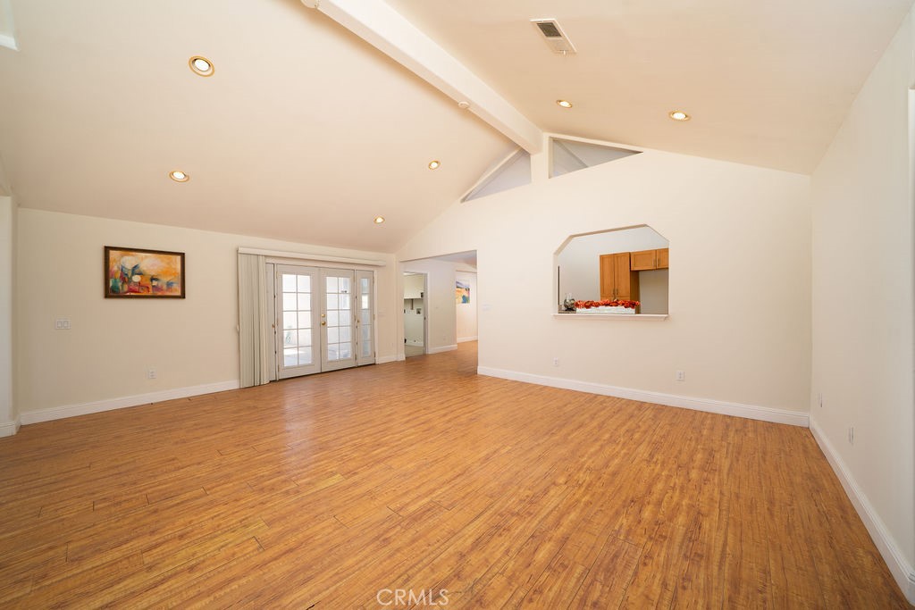 8851 Sonora Road Phelan, CA 92371 - Photo 10 of 26 a view of an empty room with wooden floor and a window