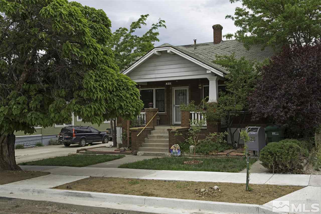 425 Roberts Street, Unit ROBERTS & 423 Reno, NV 89502 - Photo 1 of 25 a front view of a house with a garden