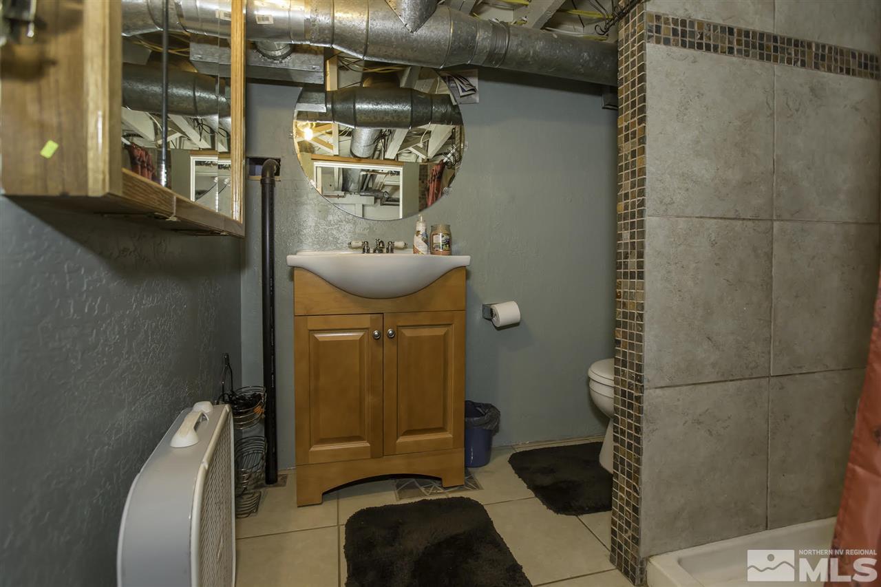 425 Roberts Street, Unit ROBERTS & 423 Reno, NV 89502 - Photo 11 of 25 a bathroom with a sink and a mirror