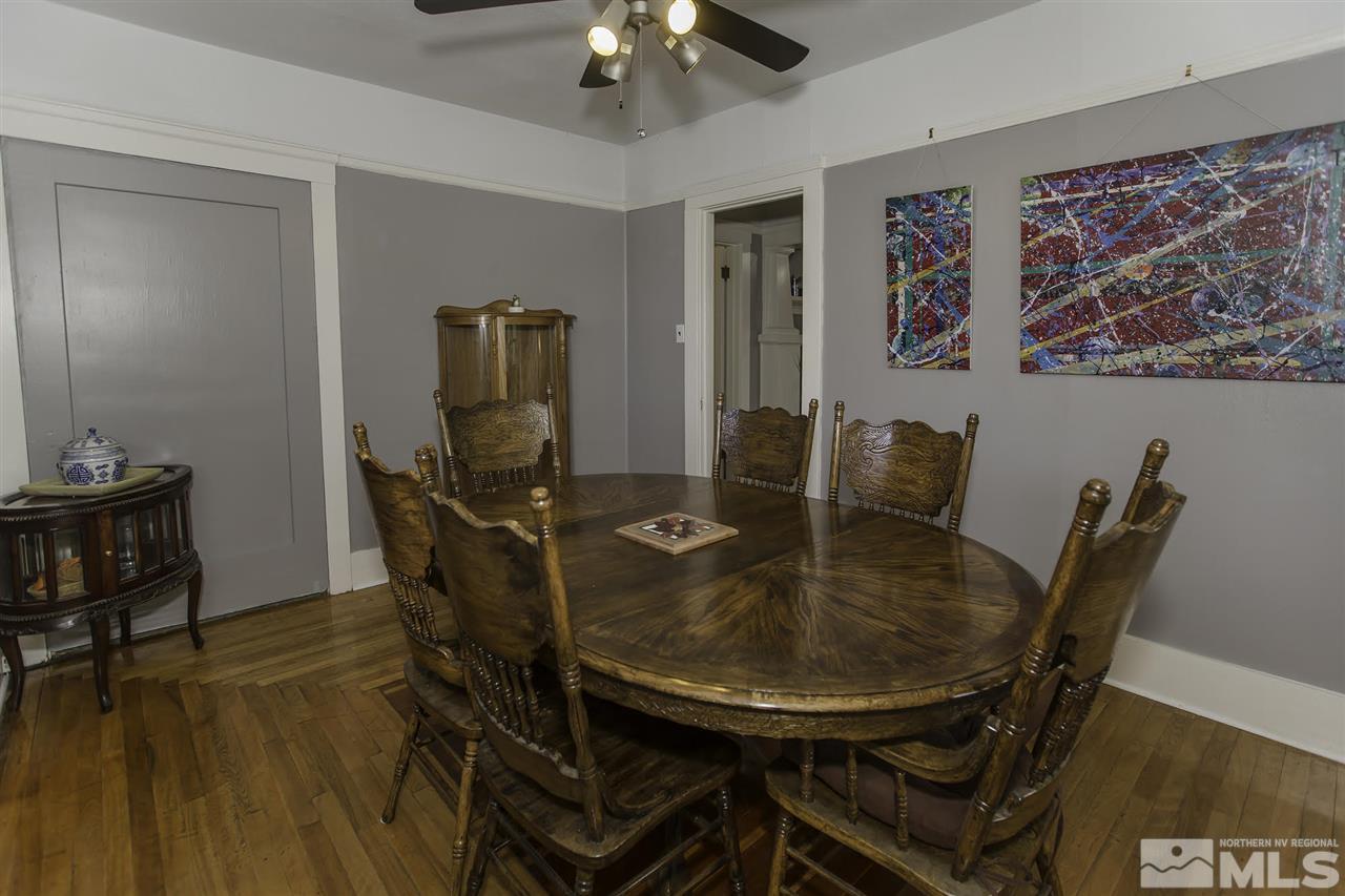 425 Roberts Street, Unit ROBERTS & 423 Reno, NV 89502 - Photo 5 of 25 a view of a dining room with furniture and wooden floor