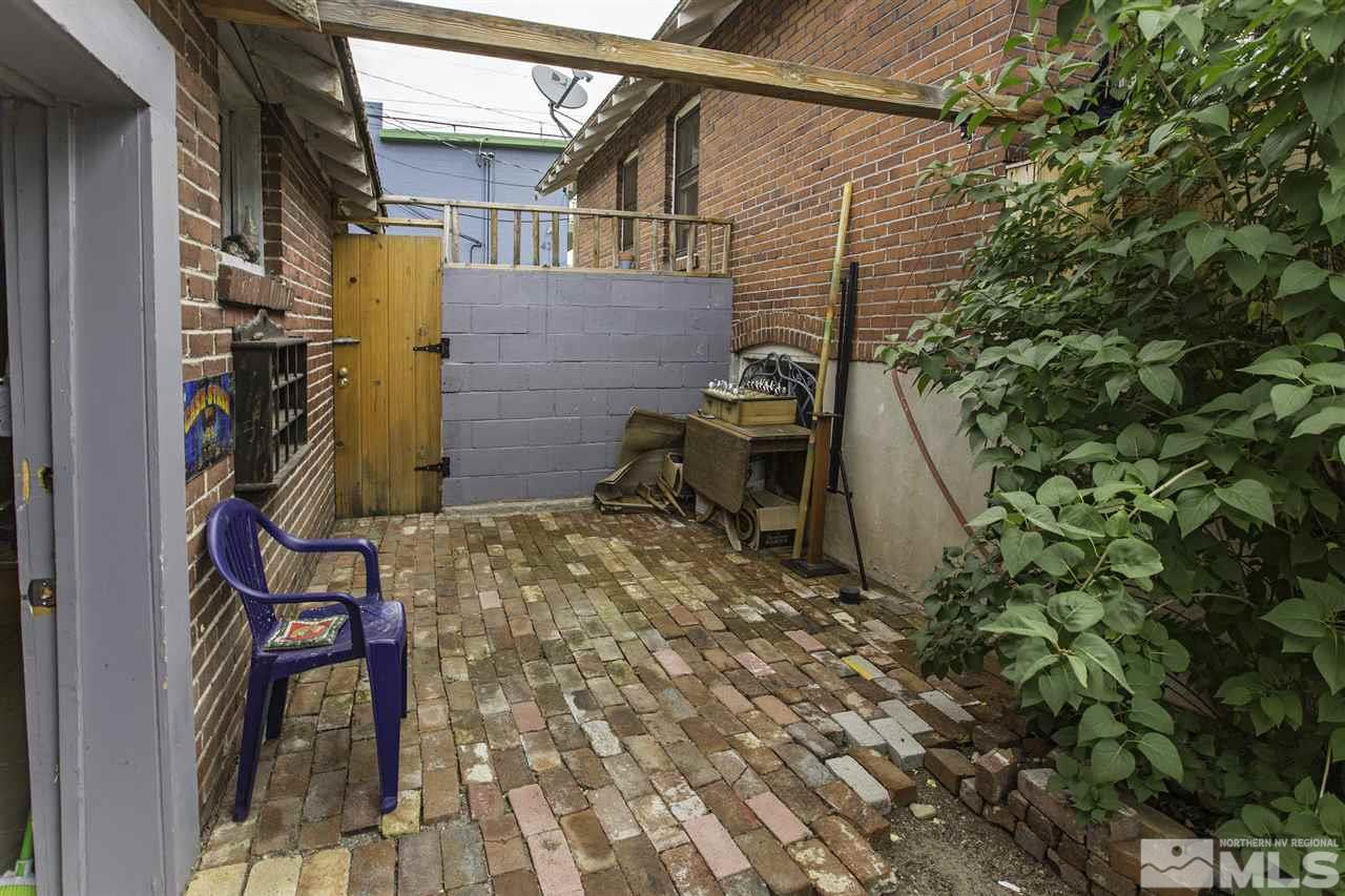 425 Roberts Street, Unit ROBERTS & 423 Reno, NV 89502 - Photo 8 of 25 a backyard of a house with table and chairs