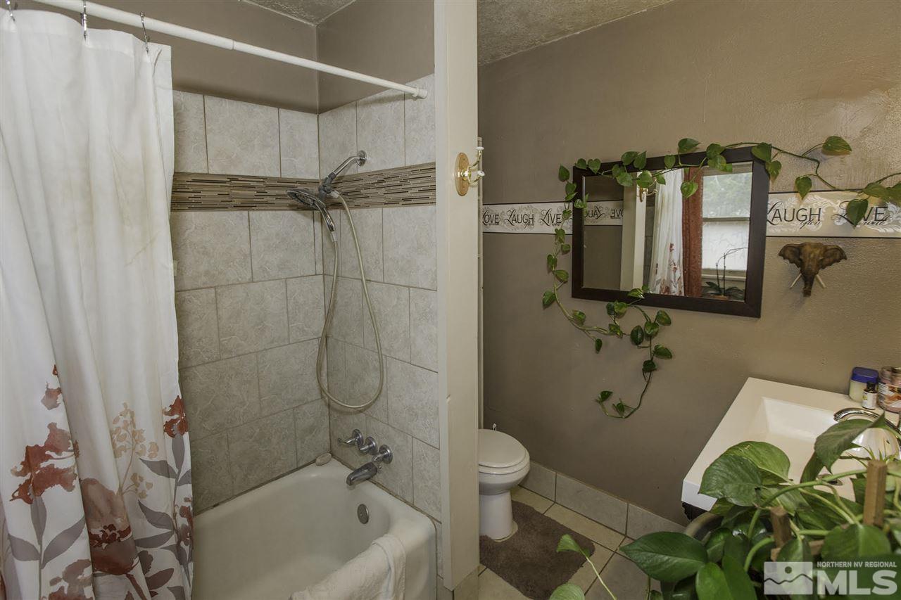 425 Roberts Street, Unit ROBERTS & 423 Reno, NV 89502 - Photo 10 of 25 a bathroom with a bathtub and a toilet