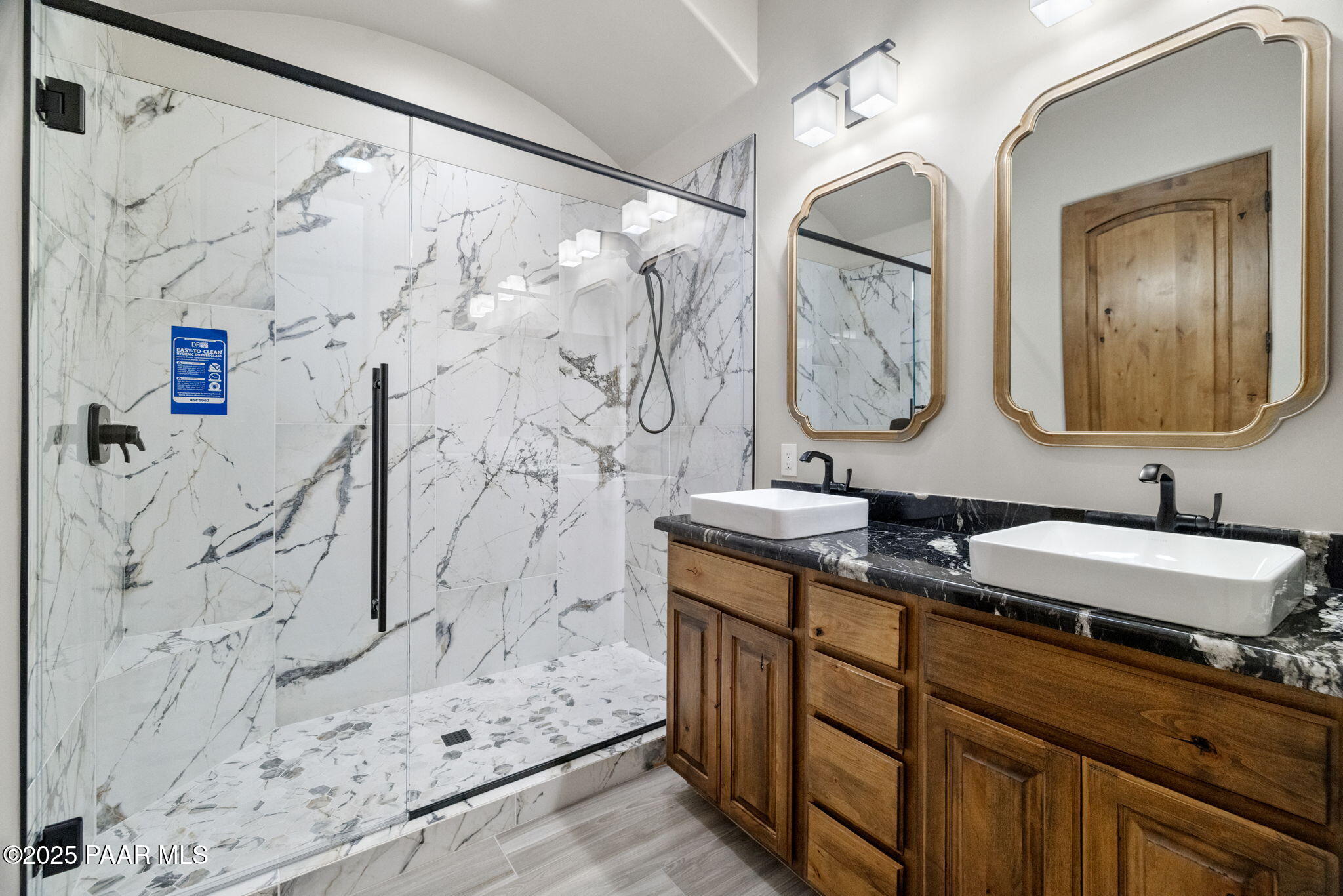 4140 Chuckwalla Road Prescott, AZ 86305 - Photo 50 of 82 a bathroom with double vanity sink and a mirror