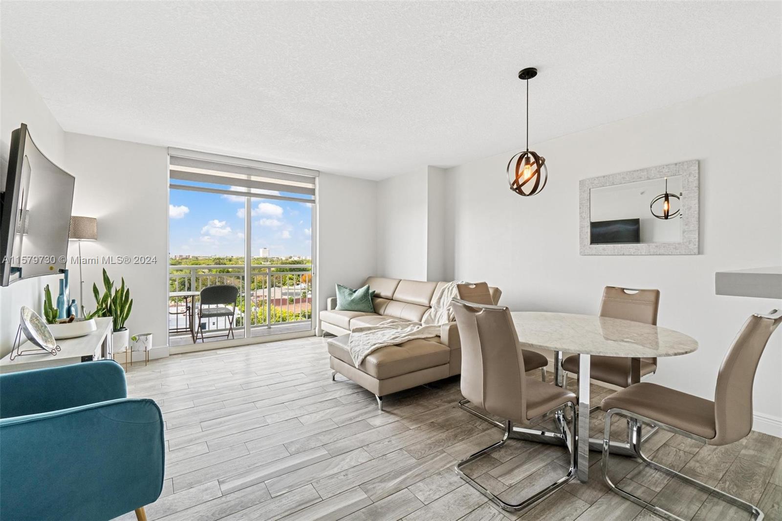3000 Coral Way, Unit 703 Miami, FL 33145 - Photo 15 of 26 a living room with furniture and a wooden floor