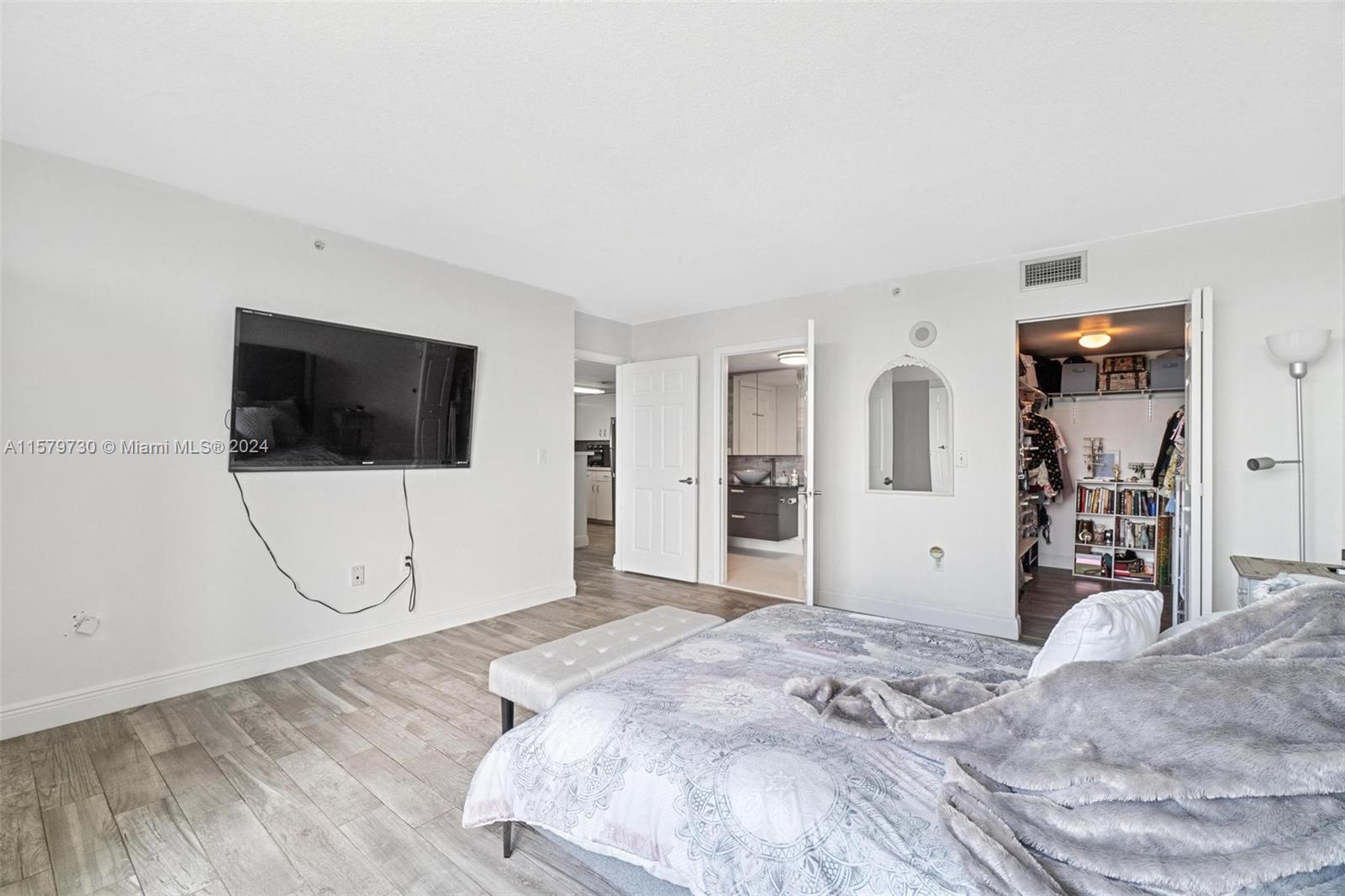 3000 Coral Way, Unit 703 Miami, FL 33145 - Photo 19 of 26 a view of a livingroom with wooden floor and furniture